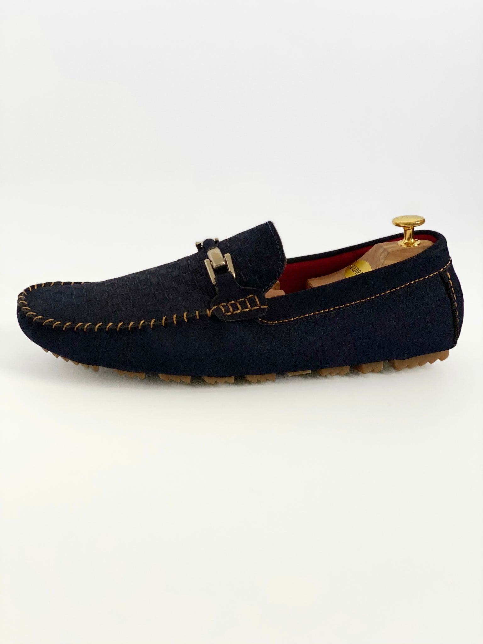 The Classic Navy Blue Nubuck Moccasin Leather Slipper Shoe With Sheepskin Lining, Rubber Soles, Leather Shoelaces, Whipstitch Details At Toe, Classic Woven Styling, And Moc-toe moccasin with saddle bit. The Moccasin is made entirely out of the softest, most comfortable, breathable and durable leather. Jebranco New York NYC. Men Moccasin Slipper Shoe, Man Moccasin Slipper Shoe, Boat Shoe, Leather Shoe, NYC Shoe Store, NYC Online Shoe Store, Navy Slippers, Slipper Shoe. 