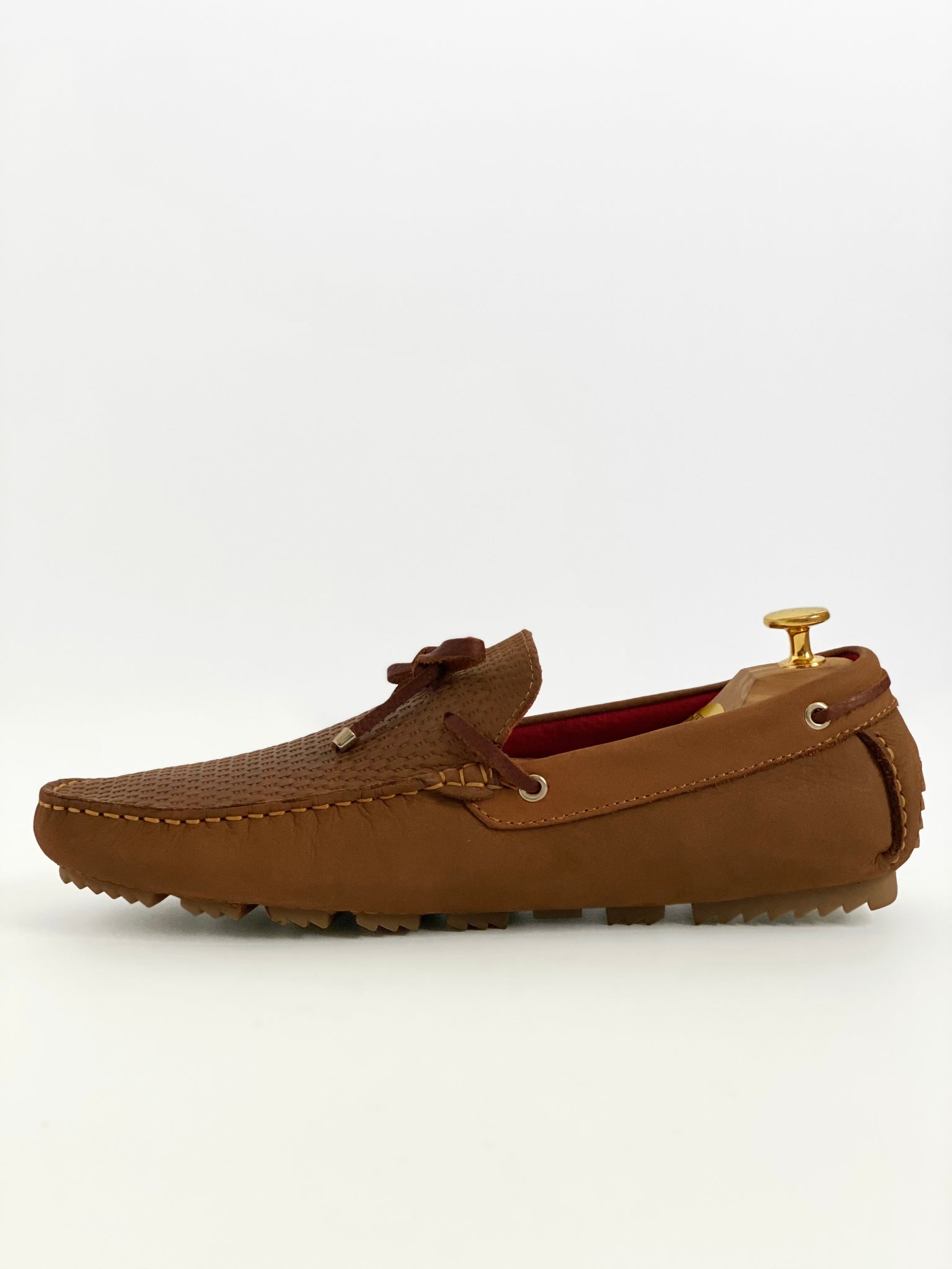 The Classic Tan Moccasin Leather Slipper Shoe With Sheepskin Lining, Rubber Soles, Leather Shoelaces, Whipstitch Details At Toe, Classic Woven Styling, And Moc-toe moccasin with saddle bit. The Moccasin is made entirely out of the softest, most comfortable, breathable and durable leather. Jebranco New York NYC. Men Moccasin Slipper Shoe, Man Moccasin Slipper Shoe, Boat Shoe, Leather Shoe, NYC Shoe Store, NYC Online Shoe Store, Slippers, Slipper Shoe. Custom Made Shoe In NYC. Tan Moccasin Slipper Shoe.